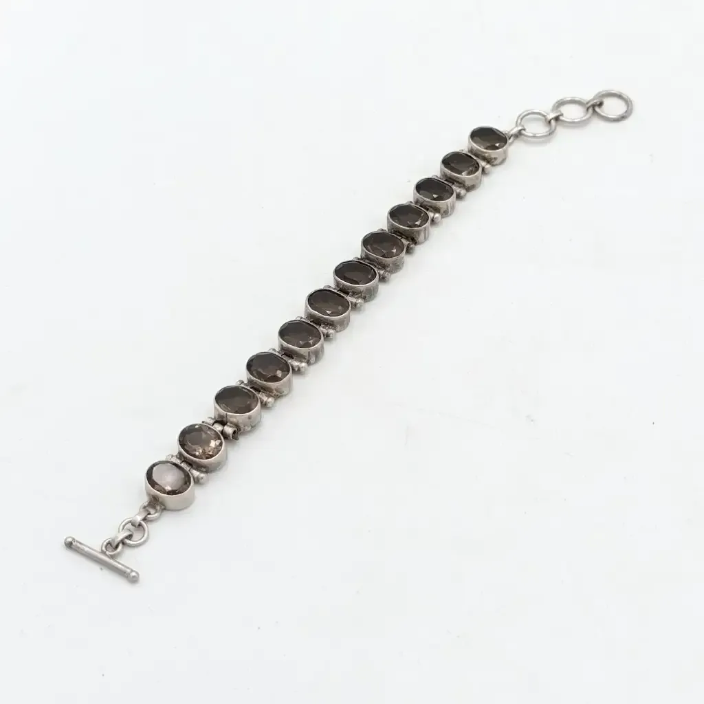 Sterling Silver Agenta bracelet with 12 smokey quarts stones of about 3 carat each - size 19cm long