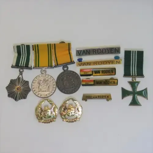 Set of SA Prison Service medals and badges issued to Warrant officer RJ. Van Rooyen