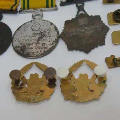 Set of SA Prison Service medals and badges issued to Warrant officer RJ. Van Rooyen