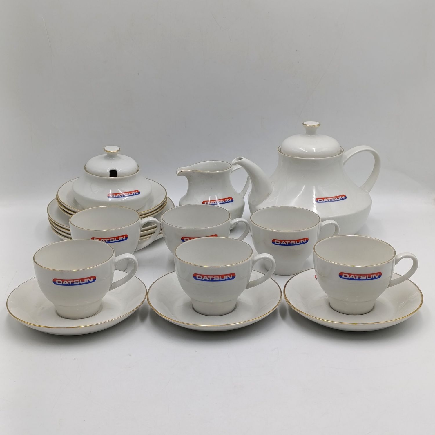 Vintage Datsun advertising porcelain tea set - 21 piece - chip in teapot rim