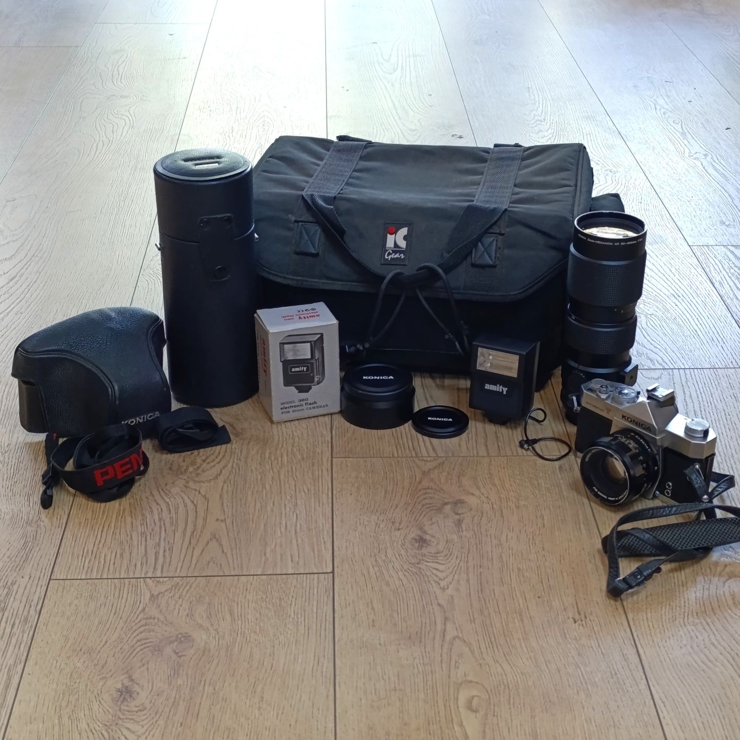 Vintage Konica Autoreflex T 35mm camera with 25mm F1.8 lens - including Konica 80-200mm lens, Amity flash and camera bag