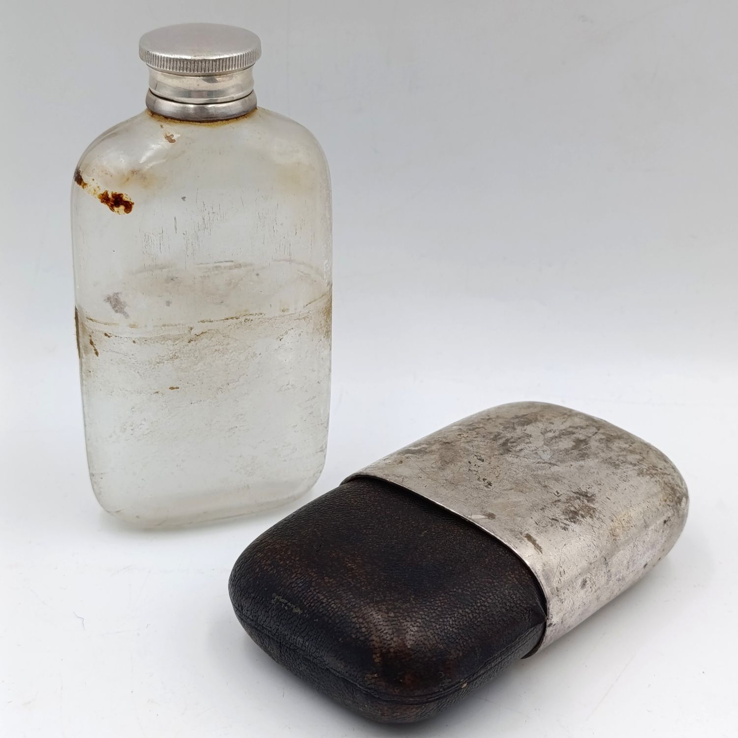 Antique Walker and Hall silverplated glass hipflask with leather cladding