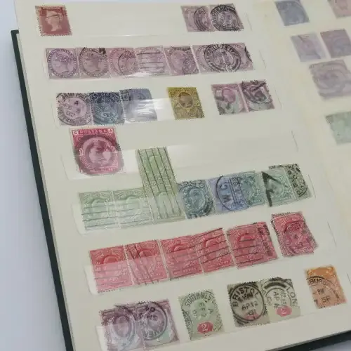 18 Page stamp album with over 700 British stamps - Including penny brown and some scarcer stamps