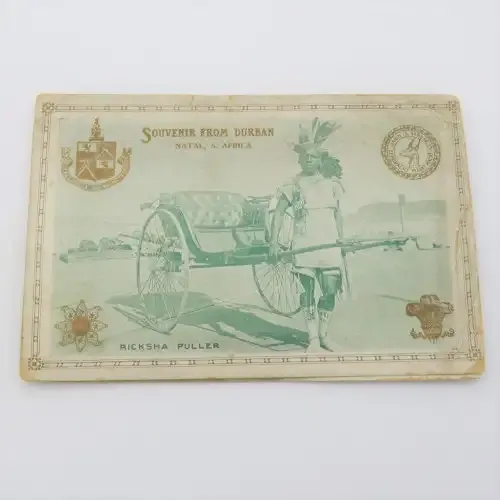 Antique souvenir card from Durban with Ricksha Puller, Grey street, street view and silver leaves