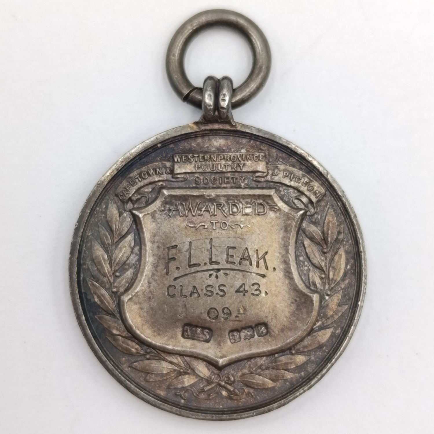 1909 Western Province Poultry medal awarded to FL Leak - Sterling silver