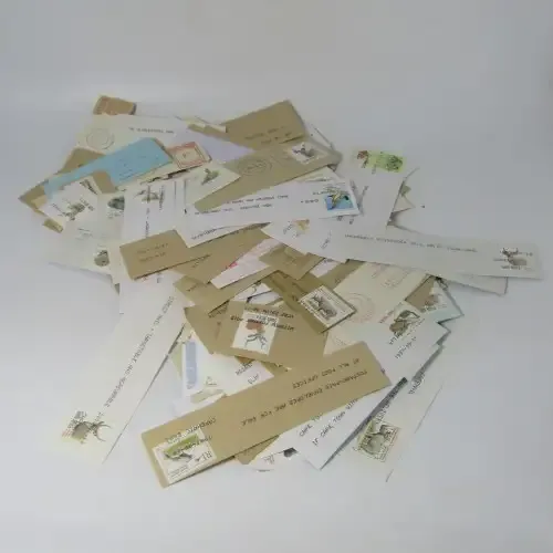 Many hundreds of stamps and postmarks on cover - unchecked