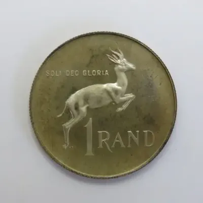 1975 South Africa silver proof one rand with die crack mark over body of Springbok