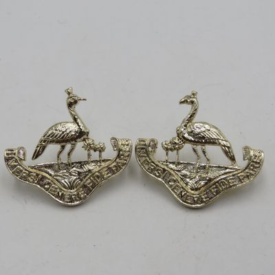 Pair of Northern Rhodesia regiment collar badges