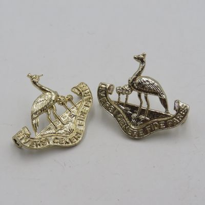 Pair of Northern Rhodesia regiment collar badges