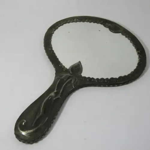Antique Pewter hand mirror with flower patterns