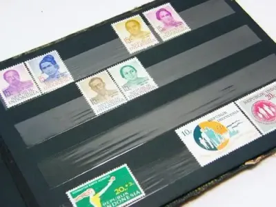 Lot of 89 indonesia mint stamps in book - as per photo