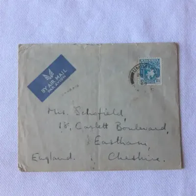 Airmail cover from Umuahia, Nigeria to Cheshire, England with one shilling threepence Nigerian stamp