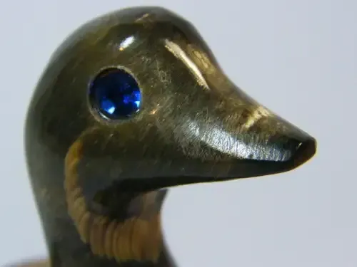 Beautiful duck figurine carved from horn with blue stone eyes