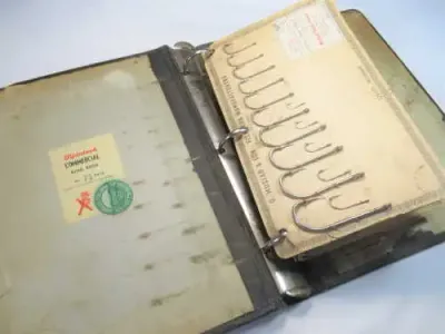 Vintage O. Mustad and Son Fish hook manufacturers salesman samples folder with 6 cards with hooks