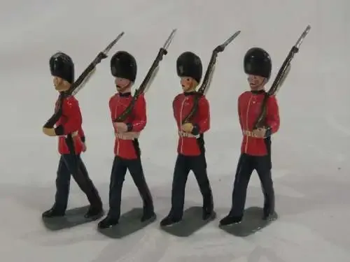 Set of 4 British lead soldiers - Guards marching with rifles
