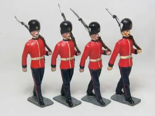 Set of 4 British lead soldiers - Guards marching with rifles