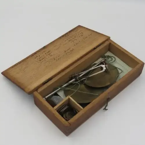 Antique pocket balancing scale with weights