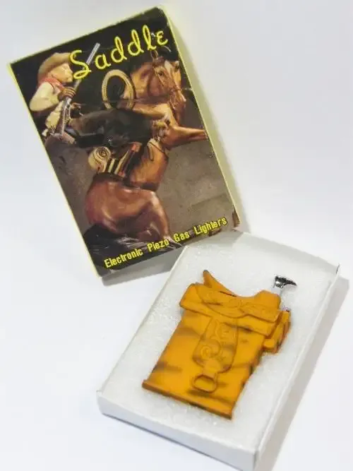 Vintage Saddle J.J horse saddle shape electric lighter with rubber finish in original box