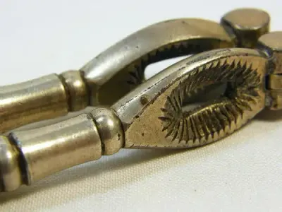 Vintage silverplated nutcracker with banded handles - as per photo
