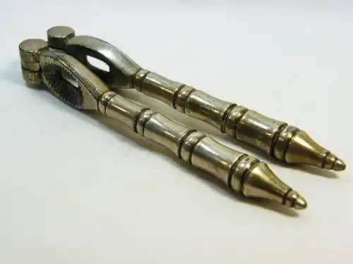 Vintage silverplated nutcracker with banded handles - as per photo