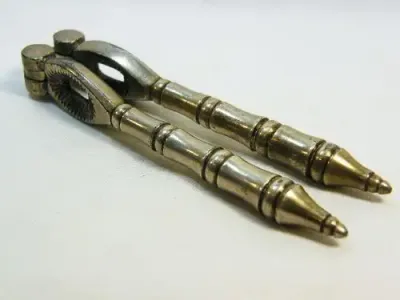 Vintage silverplated nutcracker with banded handles - as per photo