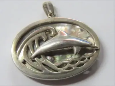 Dolphin and wave pendant in silver with abalone shell by Stuart Benade
