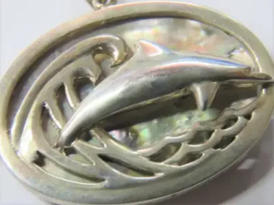 Dolphin and wave pendant in silver with abalone shell by Stuart Benade