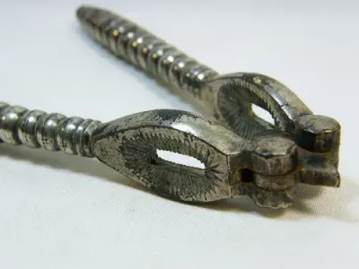 Vintage silverplated nutcracker with banded handles - as per photo