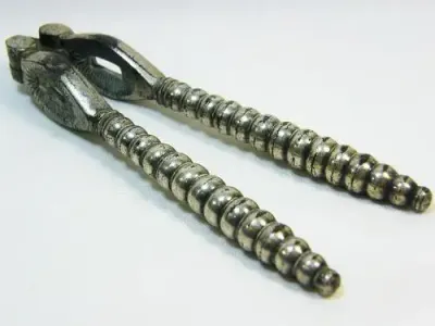 Vintage silverplated nutcracker with banded handles - as per photo