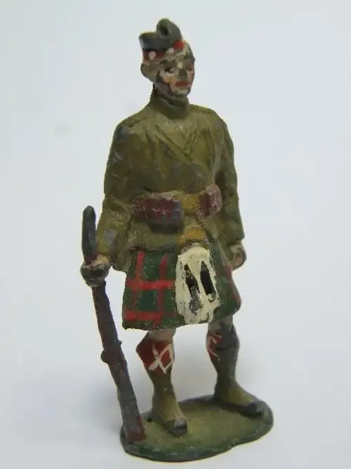 Vintage Scottish lead soldier standing with rifle - as per photo