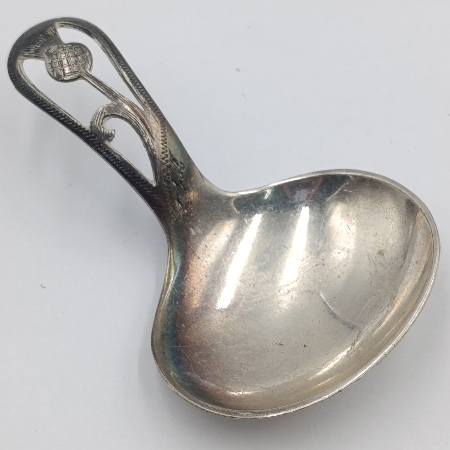 Antique Scottish silverplated tea caddy spoon with thistle design