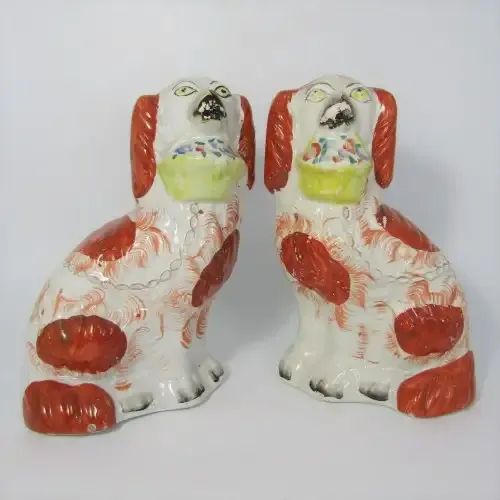 Pair of Staffordshire Spaniels porcelain figurines - some damage