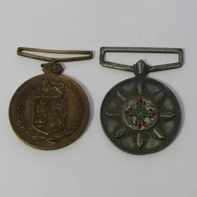 Pair of SA Police faithful service medals - issued to 33191W Sergeant PJ Louw - no ribbons