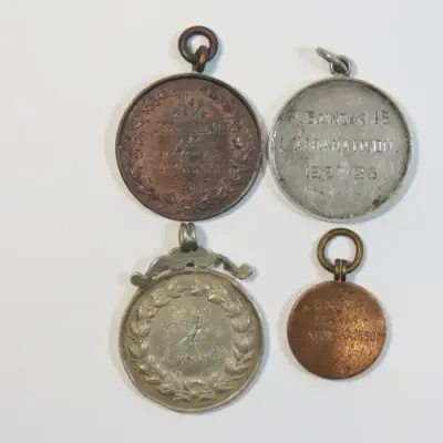 Lot of 4 swimming medals awarded to L.Abrahamson - Two in silver and 2 bronze