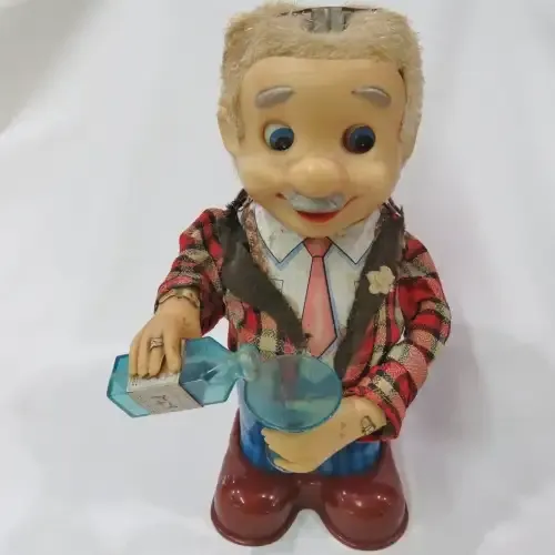 Vintage Tinplate Blushing Willy drinking man - Not working