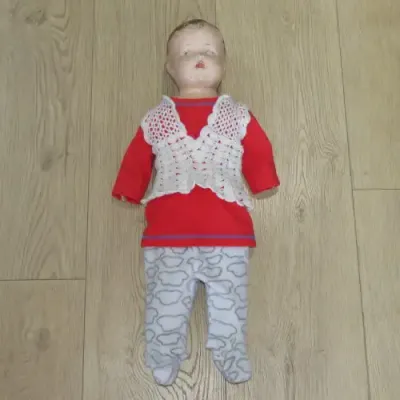 Antique Composition doll with soft body and legs - Some damage to fingers and head - Length 64 cm