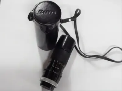Vintage Canon zoom lens 100mm-200mm 1:5.6 - With caps and case