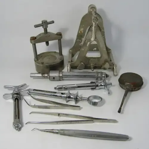 Vintage lot of dentist tools and syringes
