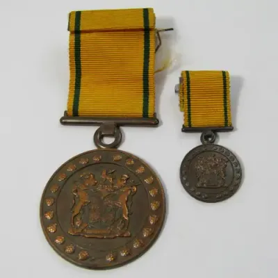 SA Prison Service Faithfull service medal issued to 15425-C Lt. EA de Brauwere with miniature