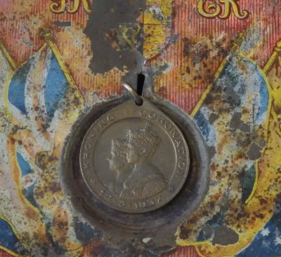 1937 Coronation souvenir tin with medallion