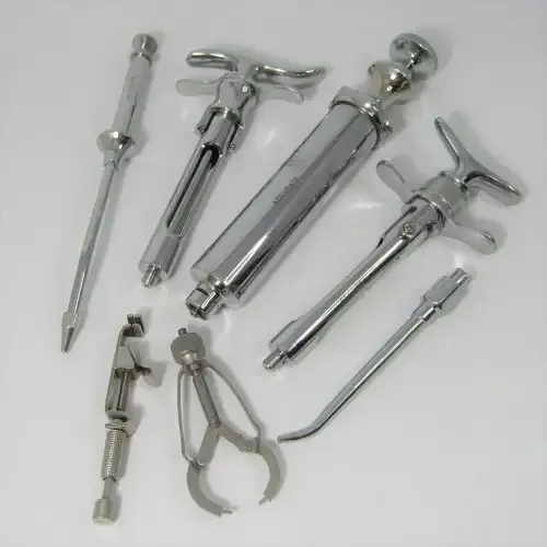 Lot of 7 stainless steel Dentist syringes and other tools