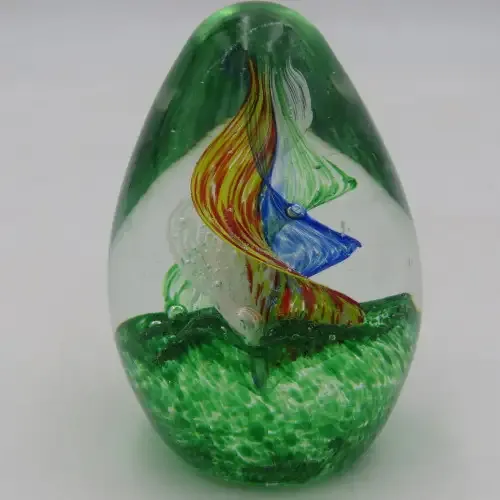 Handmade glass paperweight with spiral design