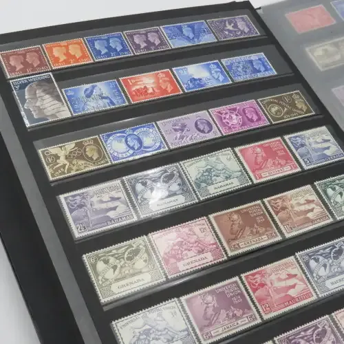 Stamp album with over 1070 stamps - England Jersey Isle of man Gibraltar mint and used