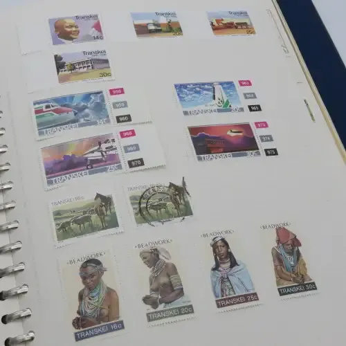 Album with over 1100 stamps including Transkei and Venda mint collections and a lot of USA stamps