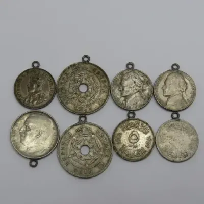 Lot of 8 coins made into pendants - Some silver in here