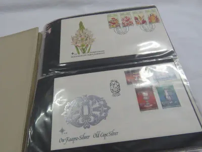 First day cover album with over 150 covers and cards - With album - Mostly South Africa