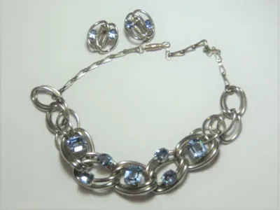 Set of costume jewellery necklace and clip-on earrings with blue stones