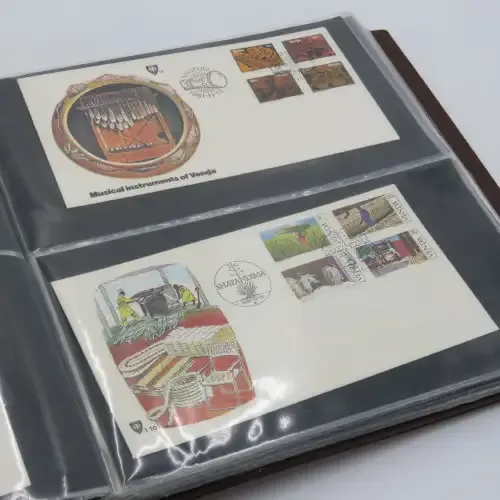 First day cover album with 72 pages and 27 covers and other items - Venda