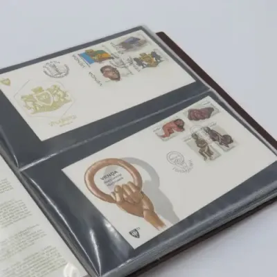 First day cover album with 72 pages and 27 covers and other items - Venda