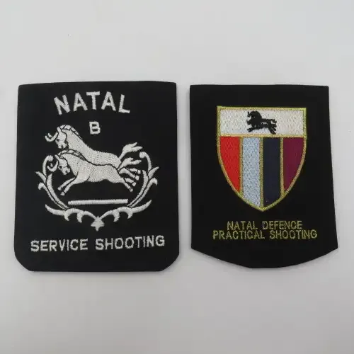 Pair of old Natal shooting cloth blazer badges